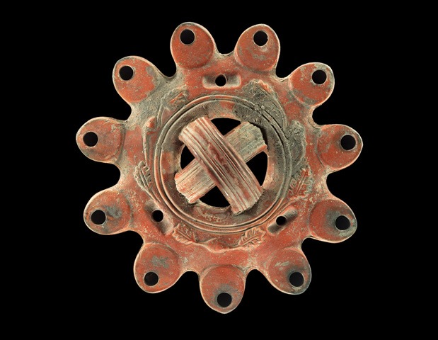 Oil lamp with eleven nozzles and a floral decoration. Pottery. 1st century BCE-4th century CE (photo by Gabi Laron)